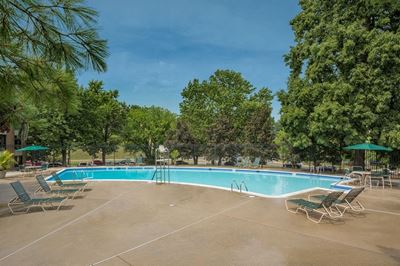pool with green and white lounge chairs at GrandView apartments in Falls Church, VA